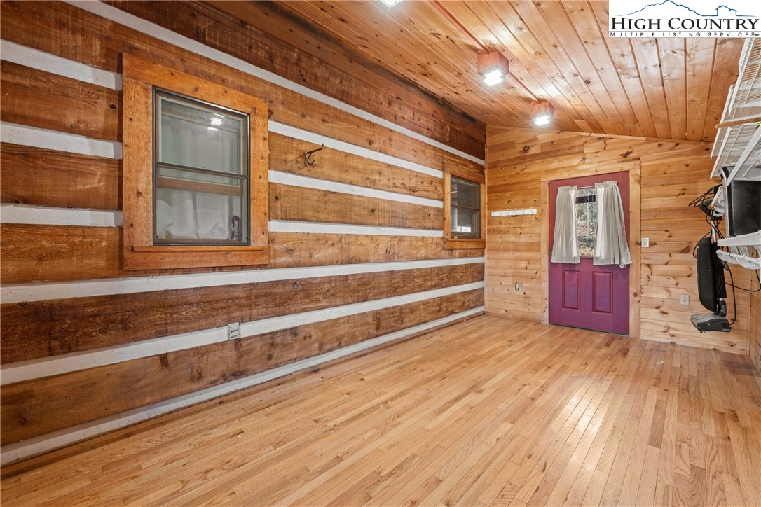 183 Laurel Branch Road Vilas, NC 28692 - Photo 19 of 39 a view of a house with wooden floor and a large window