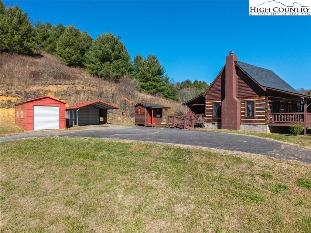 183 Laurel Branch Road Vilas, NC 28692 - Photo 25 of 39 a house view with a outdoor space