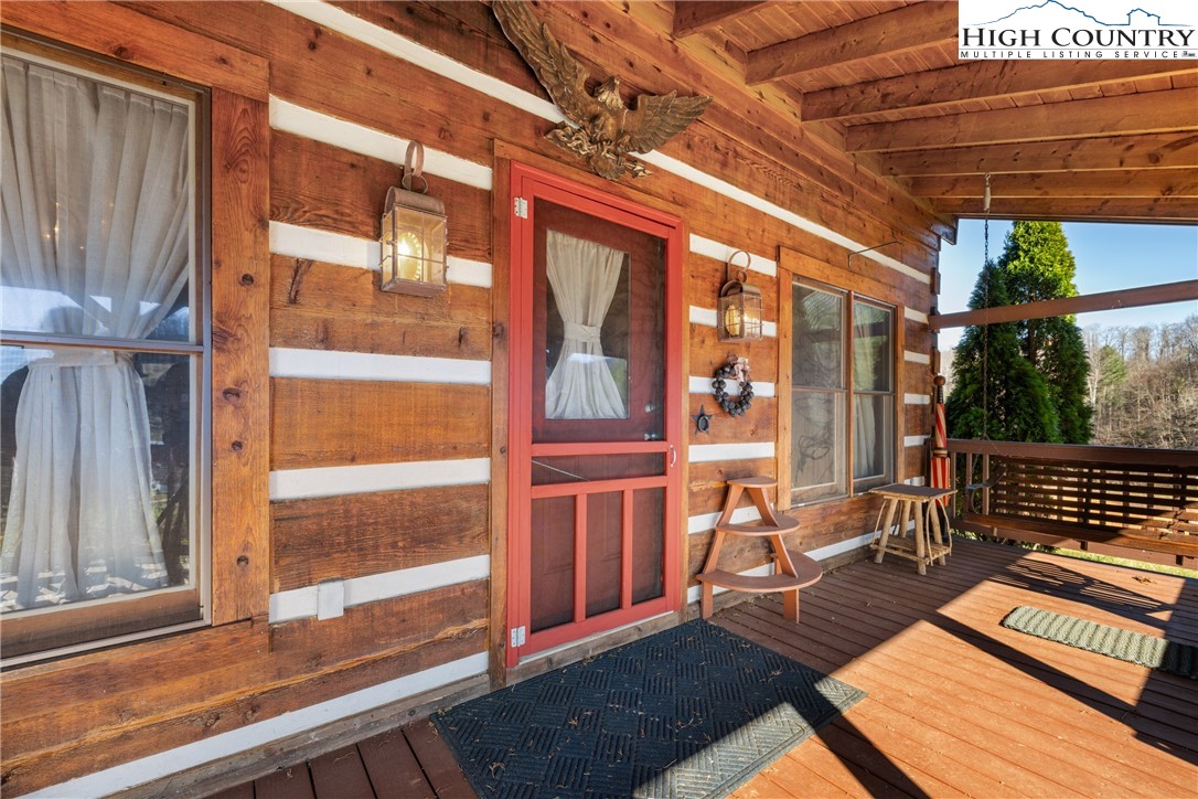 183 Laurel Branch Road Vilas, NC 28692 - Photo 3 of 39 a view of a two chair in the balcony