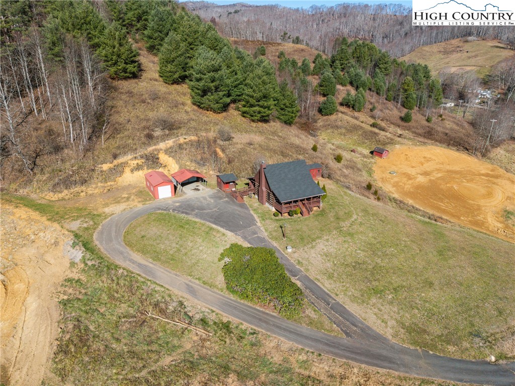 183 Laurel Branch Road Vilas, NC 28692 - Photo 33 of 39 a view of a swimming pool with a yard