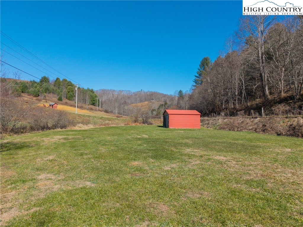 183 Laurel Branch Road Vilas, NC 28692 - Photo 34 of 39 a sign board with tall trees