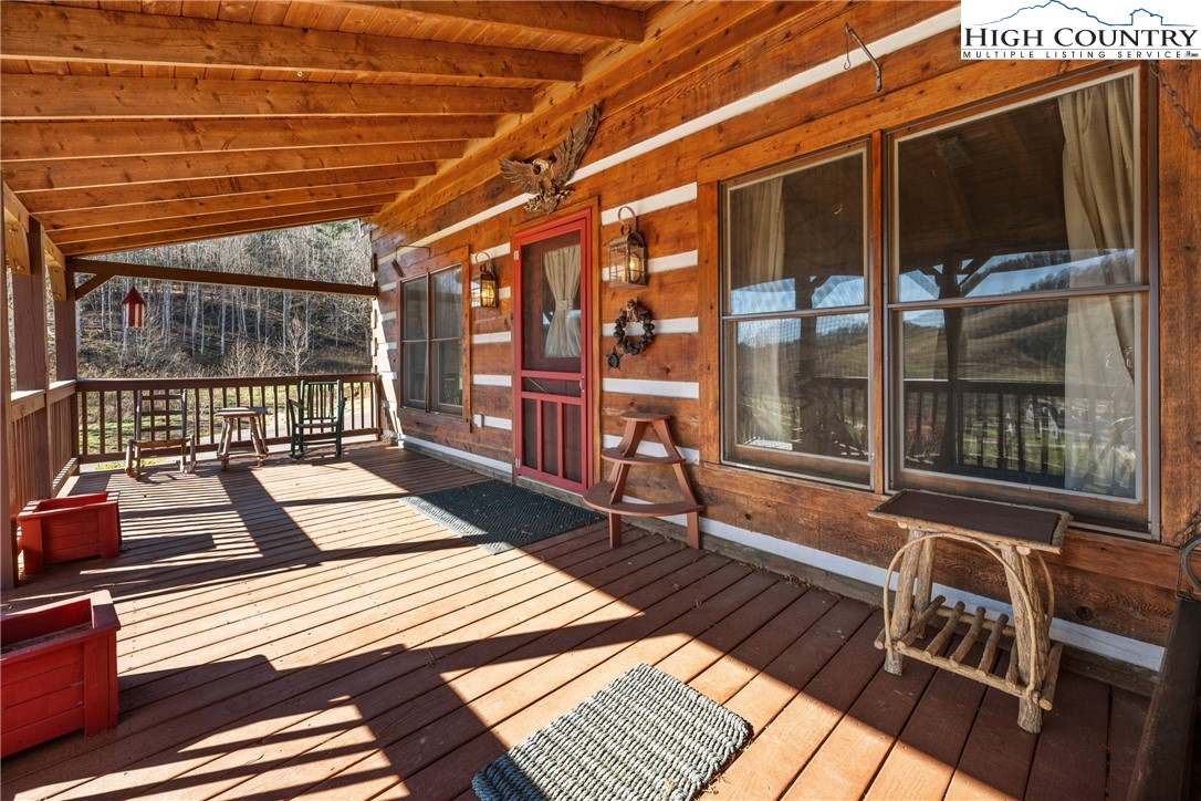 183 Laurel Branch Road Vilas, NC 28692 - Photo 4 of 39 a view of a two chairs in the balcony