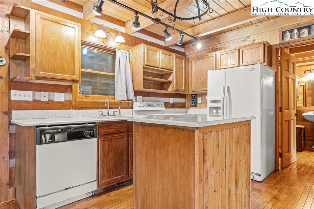 183 Laurel Branch Road Vilas, NC 28692 - Photo 10 of 39 a kitchen with stainless steel appliances granite countertop a refrigerator and a sink