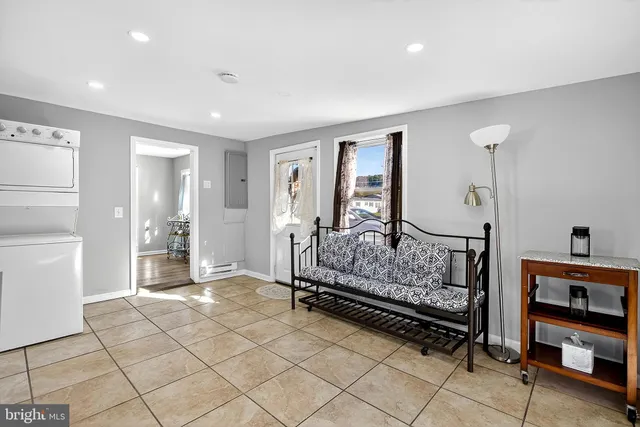 a bedroom with furniture and window