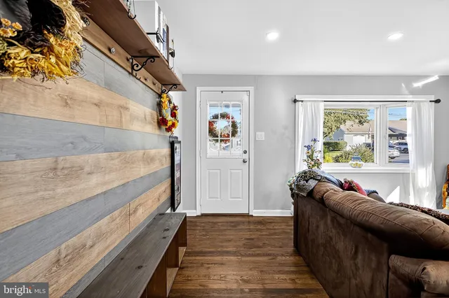 a living room with furniture and a rug