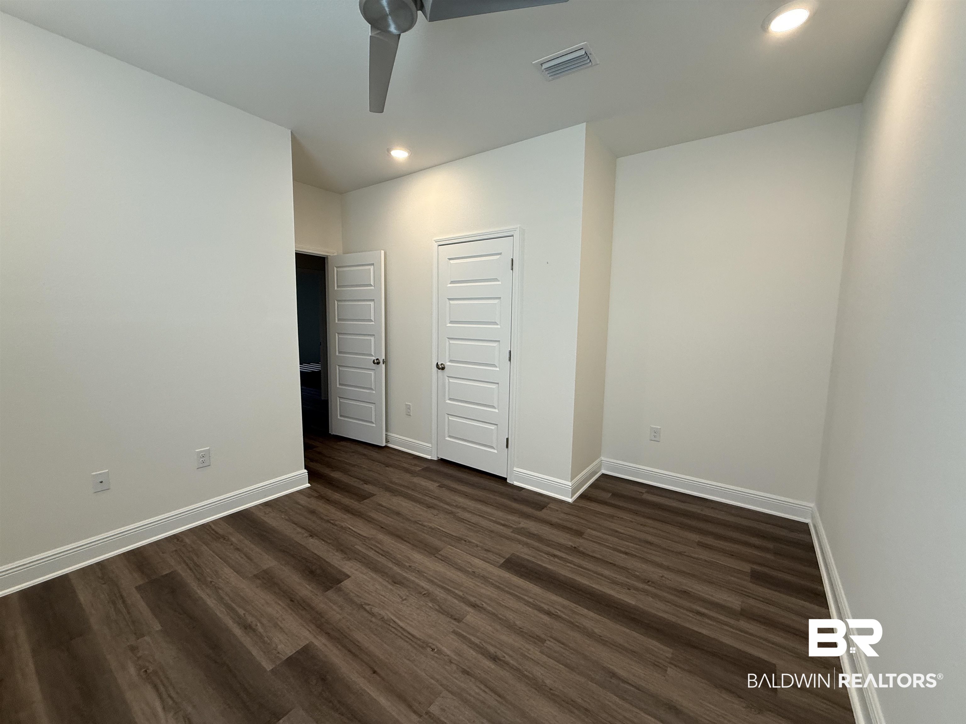 11442 Genuine Risk Circle Daphne, AL 36526 - Photo 18 of 21 Unfurnished bedroom featuring recessed lighting, dark wood-style floors, a ceiling fan, and a closet