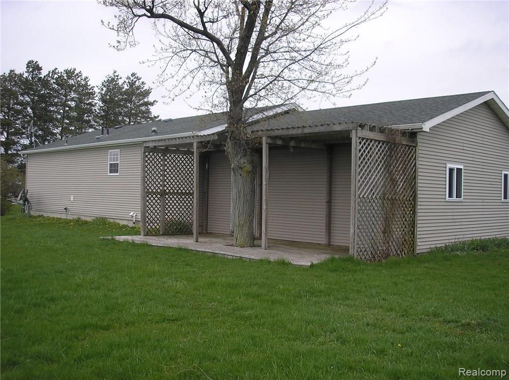 5938 North Hurds Corner Road Gagetown, MI 48735 - Photo 2 of 9 Rear view of the home with a covered patio.