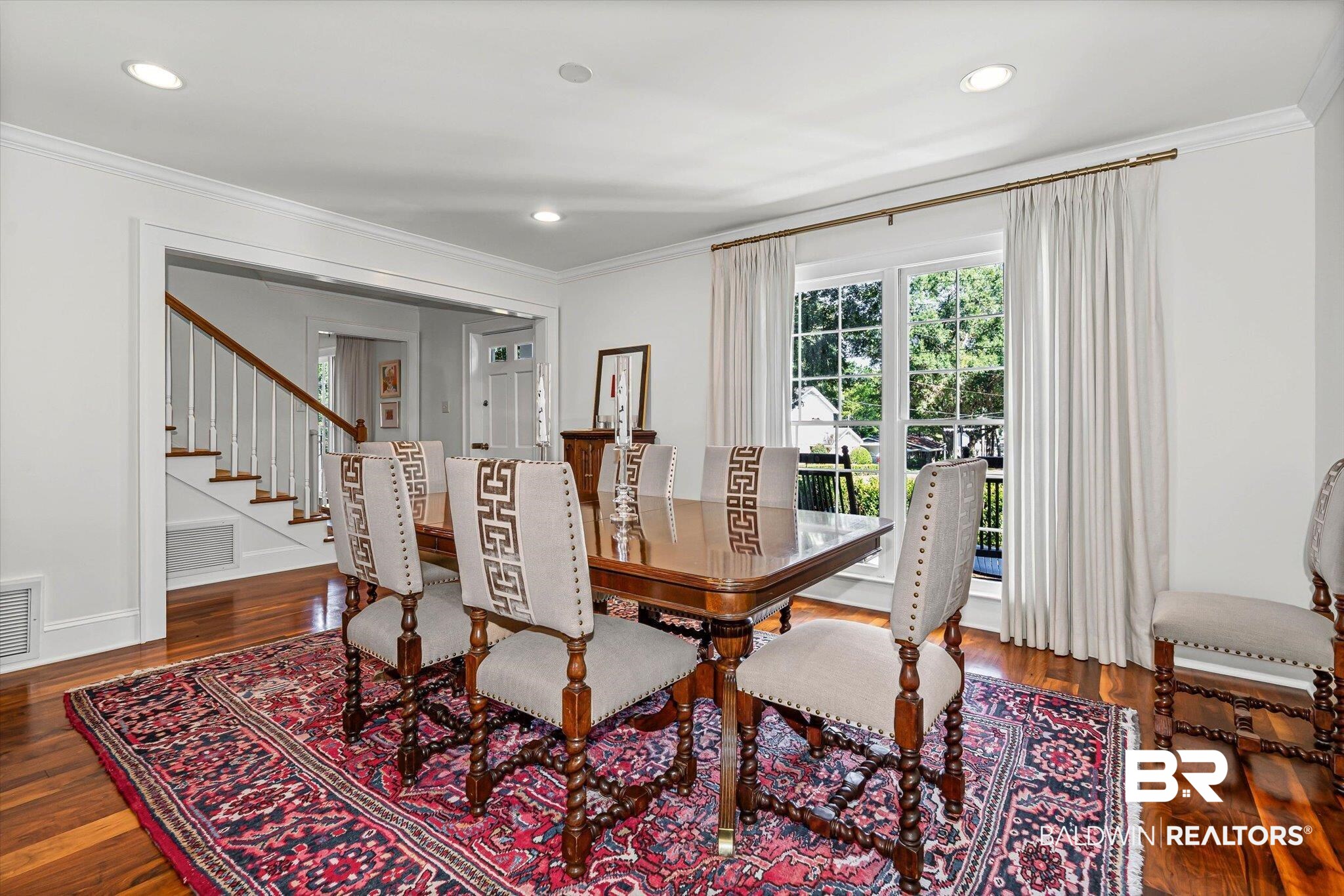 513 Spring Park Drive East Mobile, AL 36608 - Photo 10 of 44 Dining space featuring ornamental molding, dark wood-style flooring, recessed lighting, and stairs