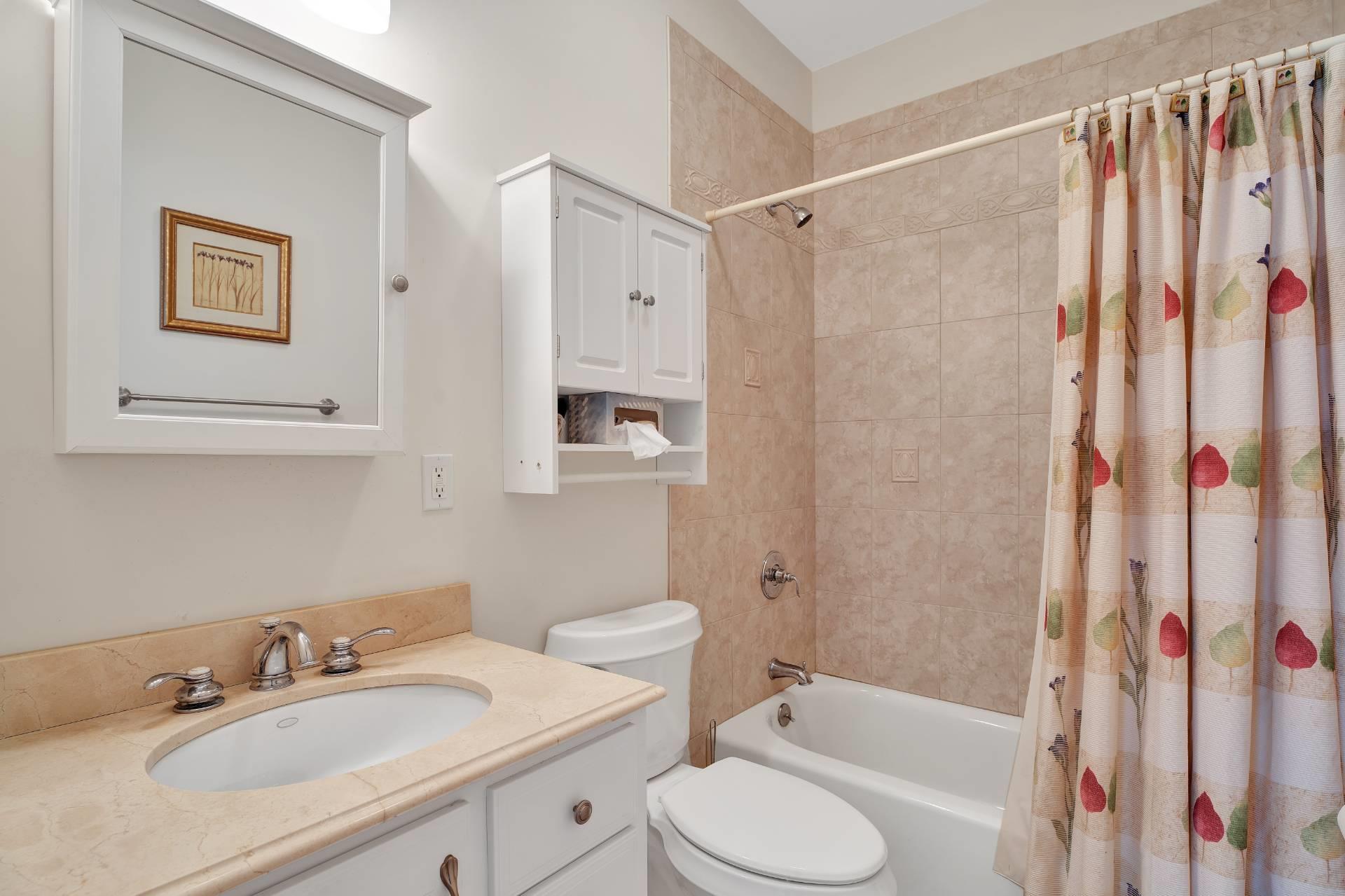 50 Sherwood Road Hampton Bays, NY 11946 - Photo 1 of 1 a bathroom with a sink toilet and shower