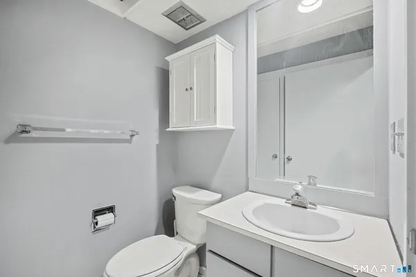 a bathroom with a glass shower door