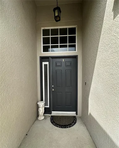 a large kitchen with stainless steel appliances and a stove top oven