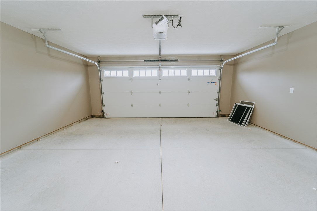 4528 West Ridgewood Road Springfield, OH 45503 - Photo 22 of 24 This spacious garage offers ample parking and storage with a convenient garage door opener.