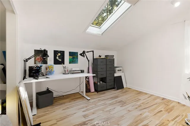 a room with a wooden floor and furniture