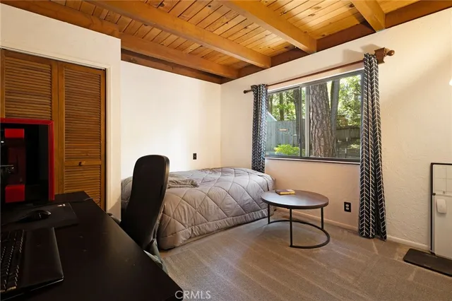 a bedroom with furniture and a window