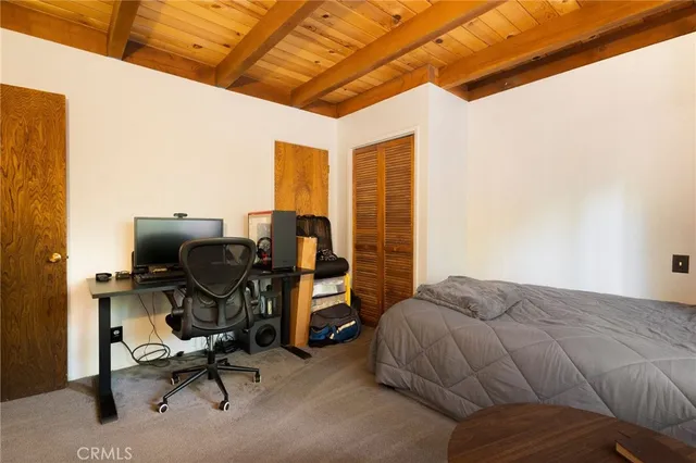 a bedroom with a workspace