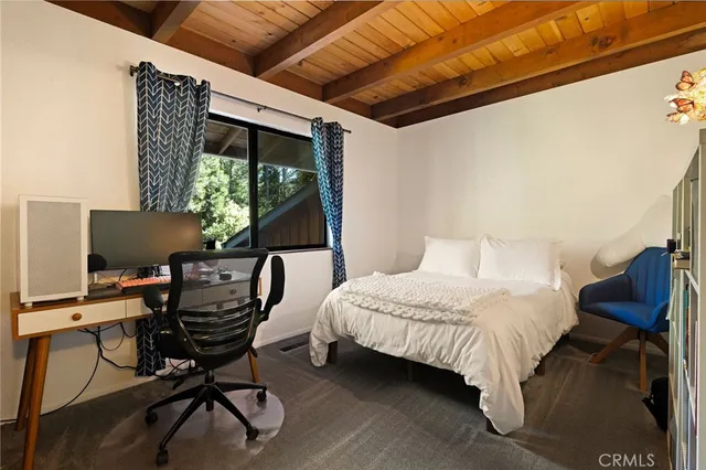 a bedroom with furniture and a window