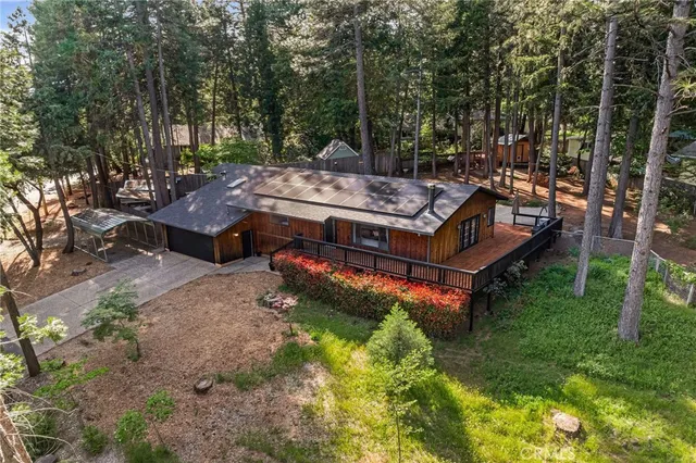 a view of a house with pool and wooden floor
