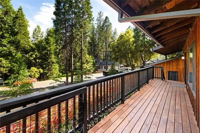 a view of balcony with wooden floor