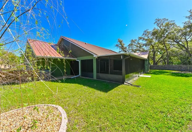 a view of an house with backyard space and garden