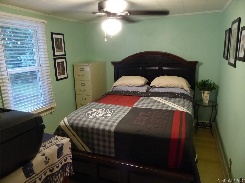 475 Brooks Lake Road Rutherfordton, NC 28139 - Photo 13 of 28 a bedroom with a bed and cabinets