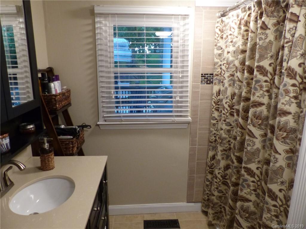 475 Brooks Lake Road Rutherfordton, NC 28139 - Photo 14 of 28 a bathroom with a sink and a mirror