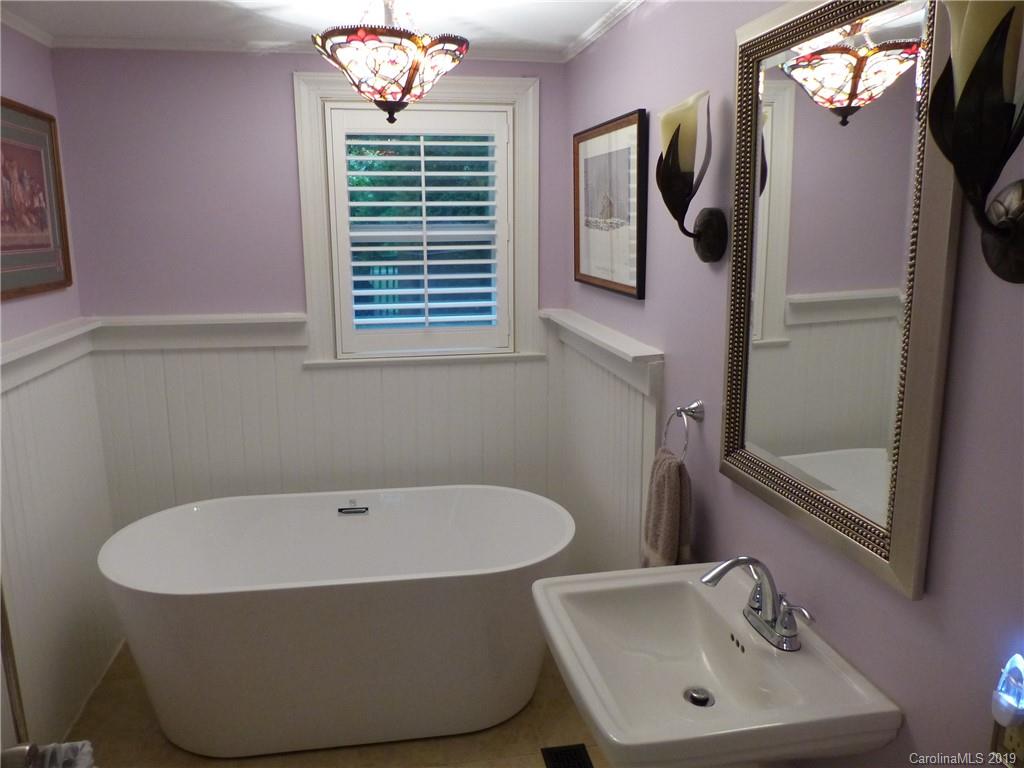 475 Brooks Lake Road Rutherfordton, NC 28139 - Photo 21 of 28 a bathroom with a tub sink and window