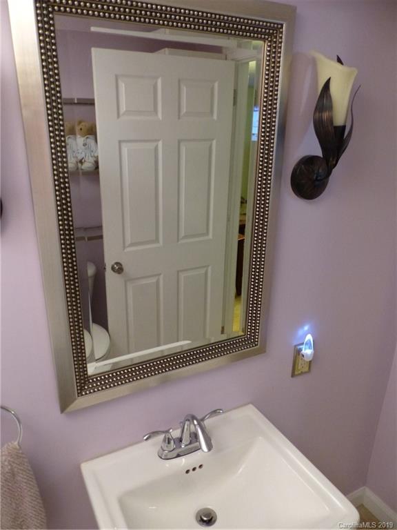 475 Brooks Lake Road Rutherfordton, NC 28139 - Photo 22 of 28 a bathroom with a sink and a mirror