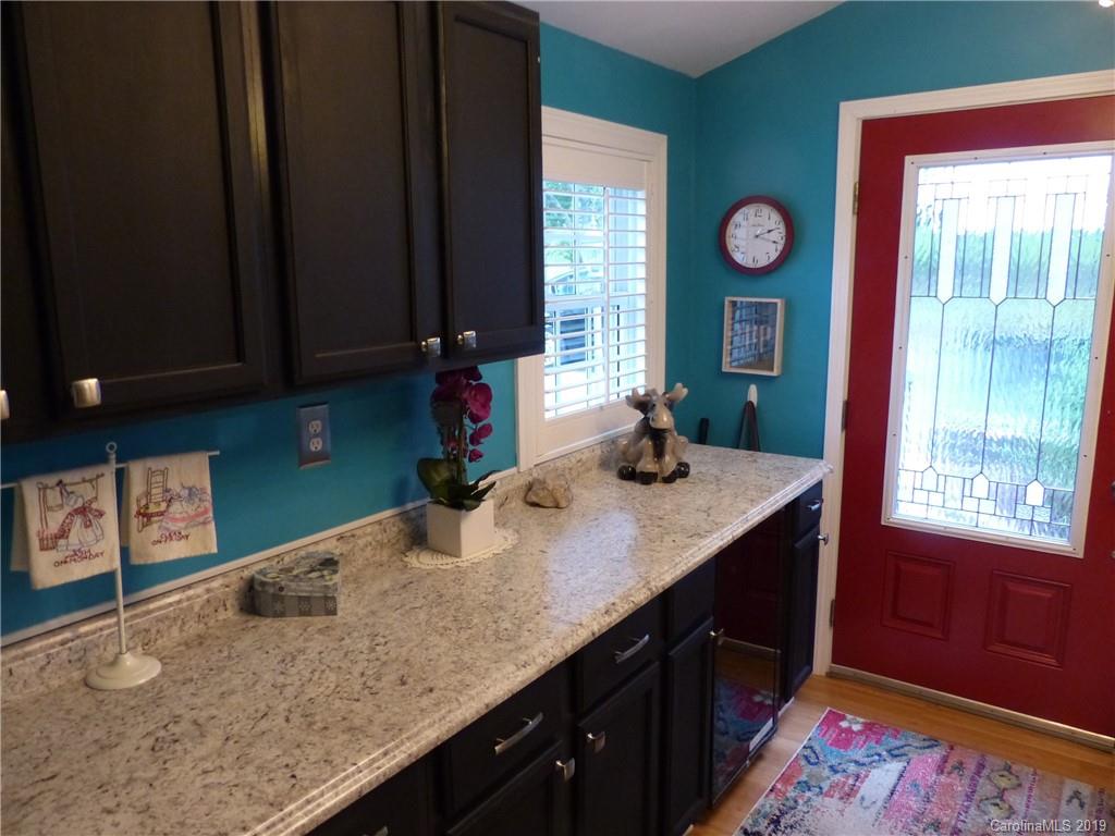 475 Brooks Lake Road Rutherfordton, NC 28139 - Photo 24 of 28 a kitchen with a sink a window and cabinets