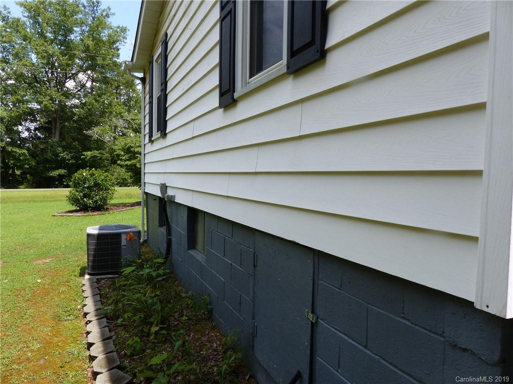 475 Brooks Lake Road Rutherfordton, NC 28139 - Photo 5 of 28 a backyard of a house with wooden floor and outdoor seating