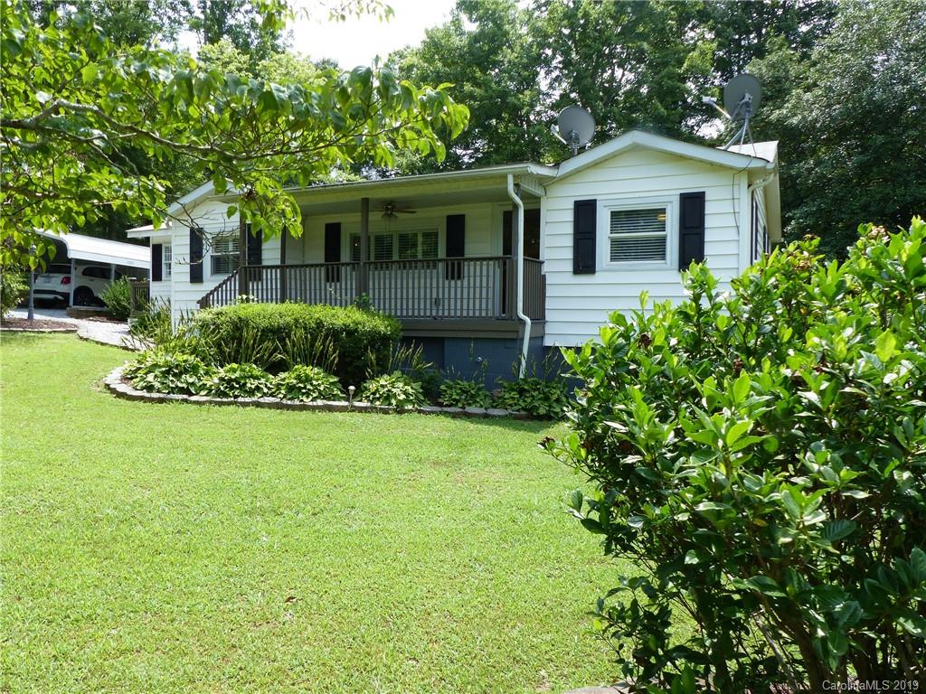 475 Brooks Lake Road Rutherfordton, NC 28139 - Photo 8 of 28 a front view of a house with a garden