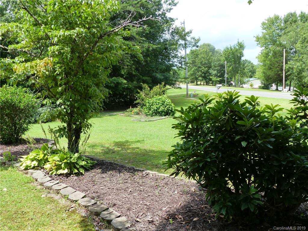 475 Brooks Lake Road Rutherfordton, NC 28139 - Photo 9 of 28 a view of a garden with plants and large trees