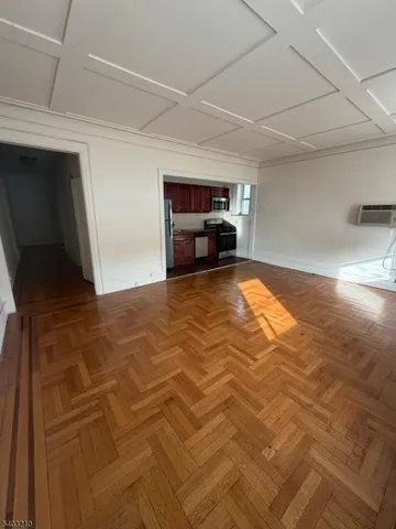 a view of a livingroom with furniture and flat screen tv