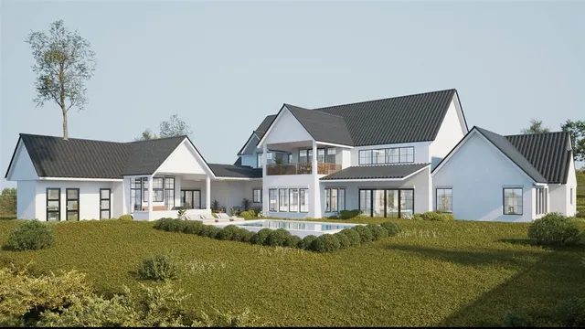 a living room filled with furniture and a large window