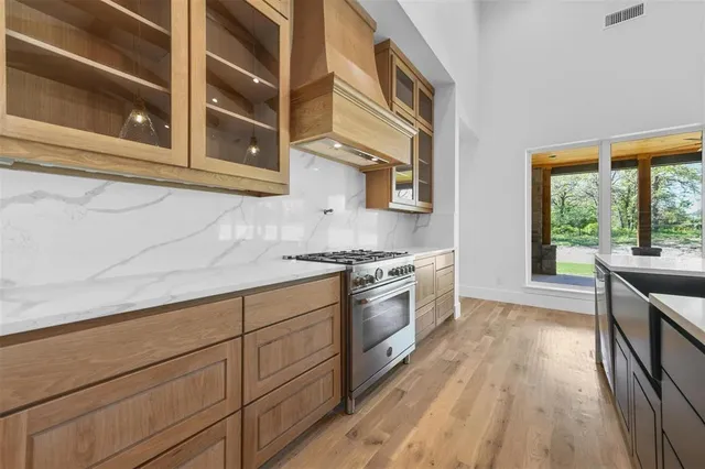 a living room with furniture a flat screen tv and a table