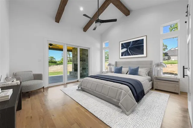 a bathroom with a granite countertop tub sink and mirror