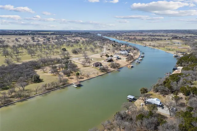an aerial view of a residential houses with outdoor space