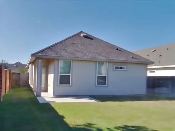 a view of a house with backyard and swimming pool