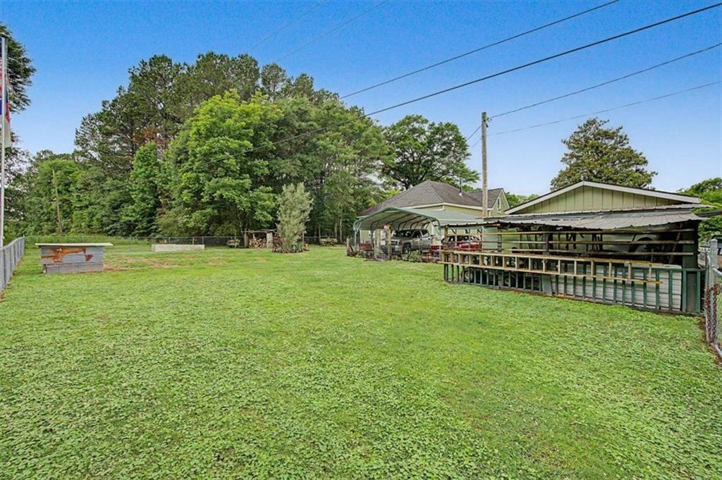 483 Coal Road Northwest Resaca, GA 30735 - Photo 45 of 56 a view of outdoor space with deck and yard
