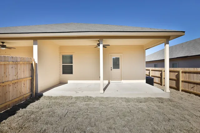 a view of empty room with wooden floor and cabinet