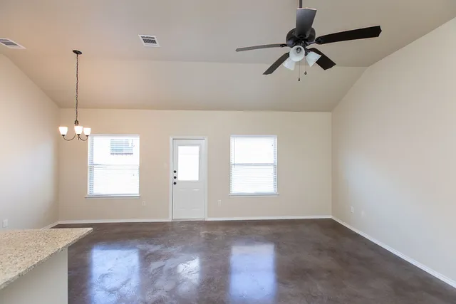 a view of an empty room with a window