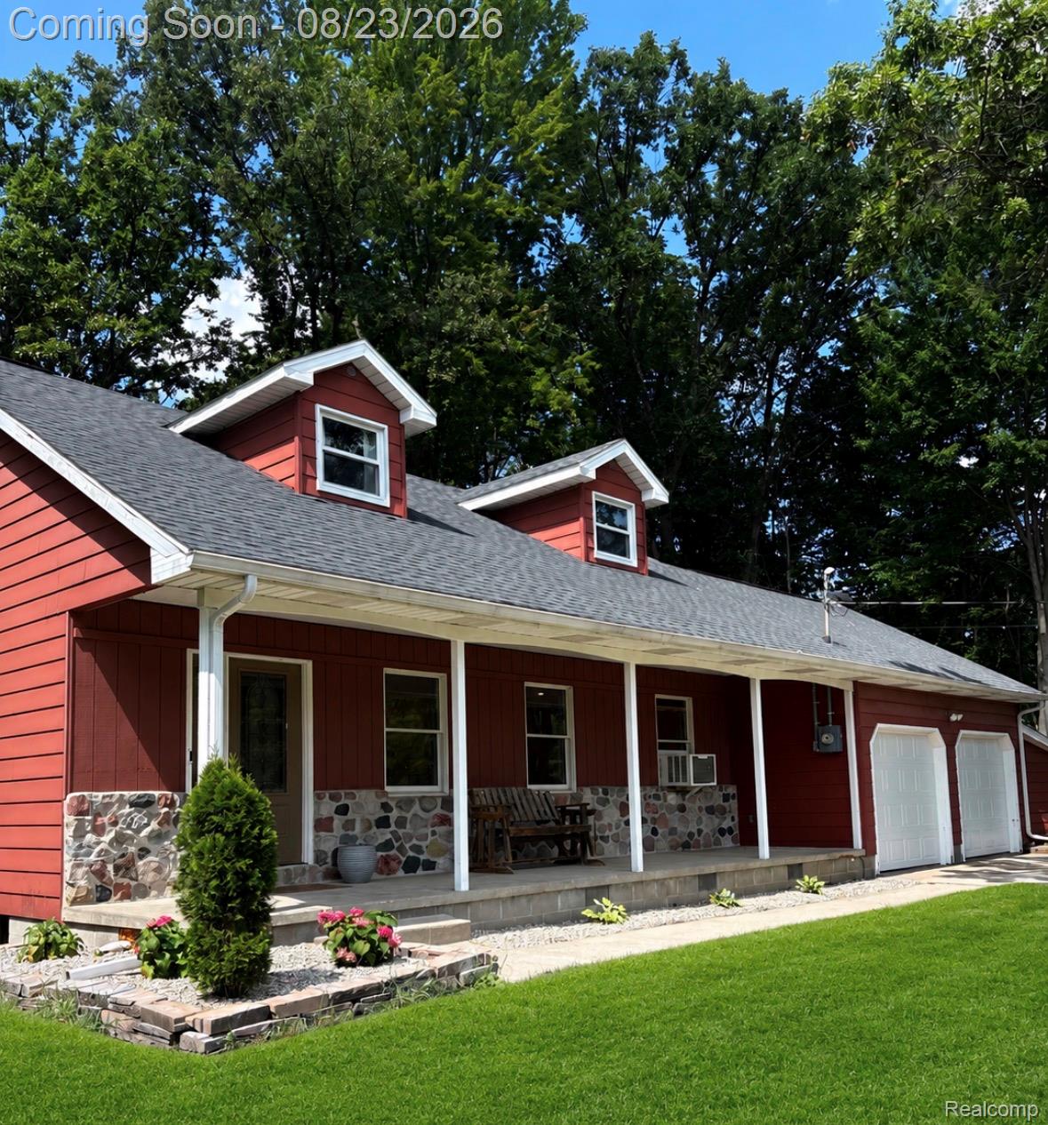 184 South 9 Mile Road Midland, MI 48640 - Photo 1 of 1 Red siding exterior with a stone veneer foundation
