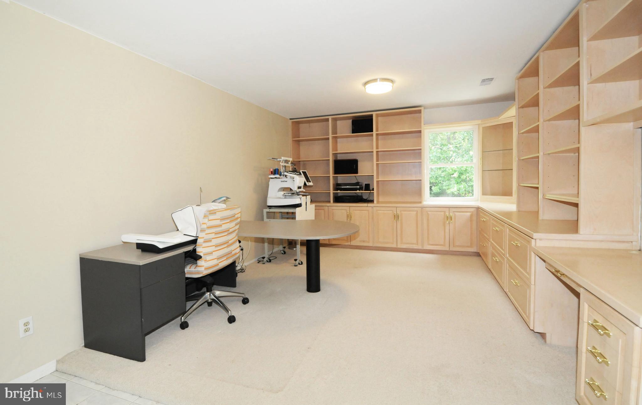7821 Elba Road Alexandria, VA 22306 - Photo 41 of 54 LOWER REC ROOM WITH FLOOR TO CEILING BUILT-INS