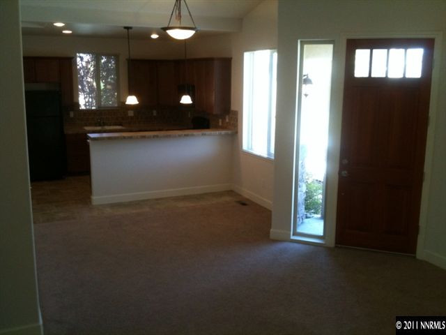 3681 Warren Way, Unit B Reno, NV 89509 - Photo 3 of 6 a view of livingroom and kitchen with hardwood