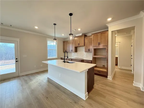 a front view of a house with a yard and dinning table