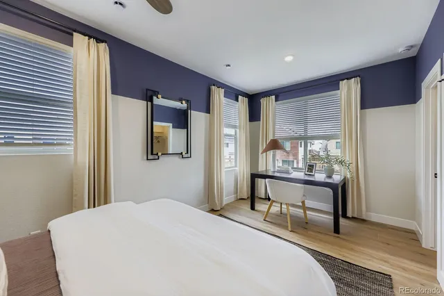 a bedroom with a bed and a table