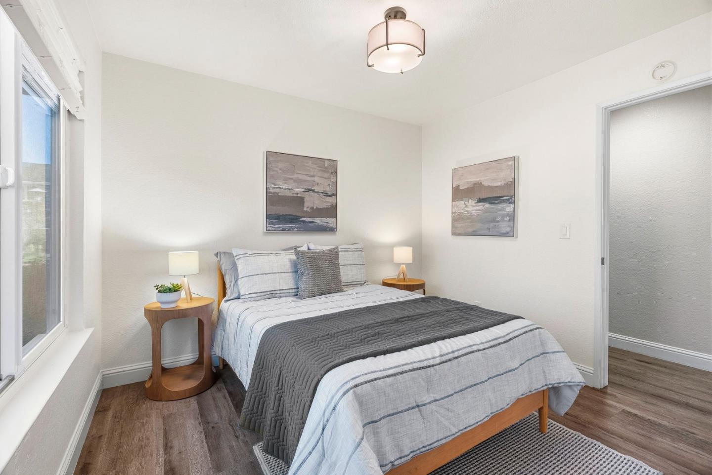 297 Perch Way Aptos, CA 95003 - Photo 21 of 42 a bedroom with a bed and wooden floor