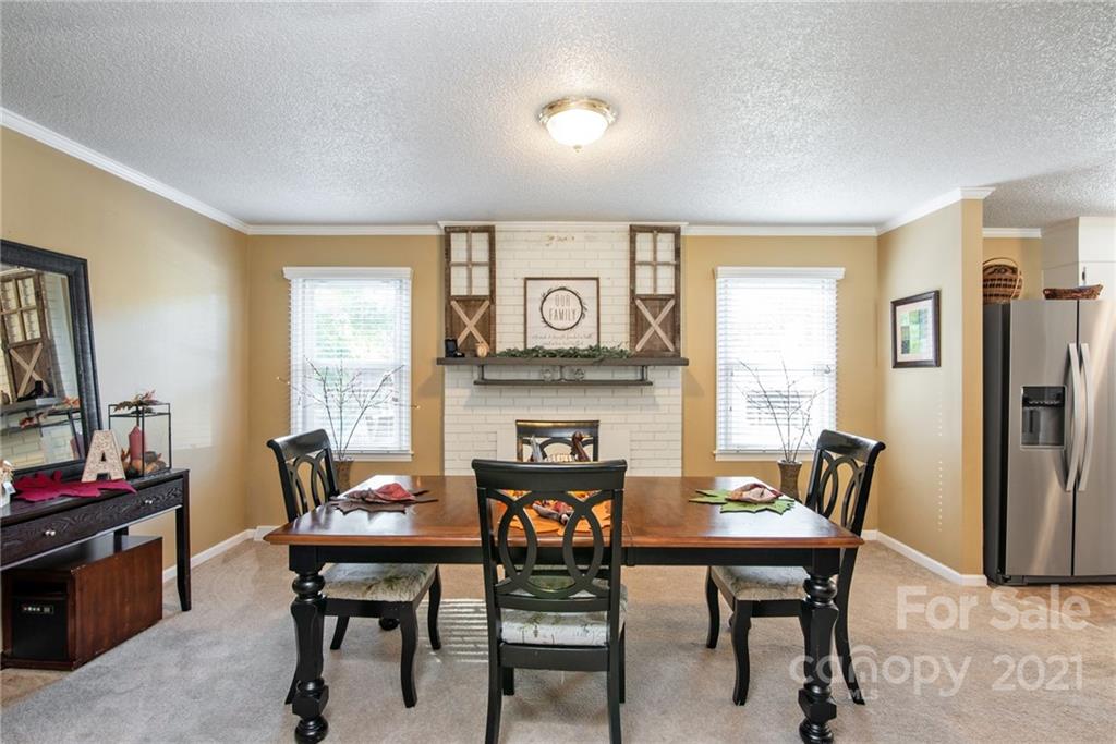 918 Zeb Helms Road Monroe, NC 28112 - Photo 8 of 28 a view of a dining room with furniture and a window