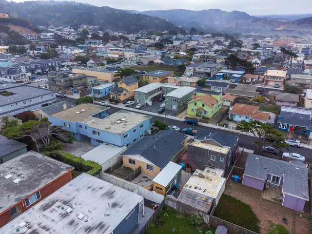 an aerial view of a city with lots of residential buildings