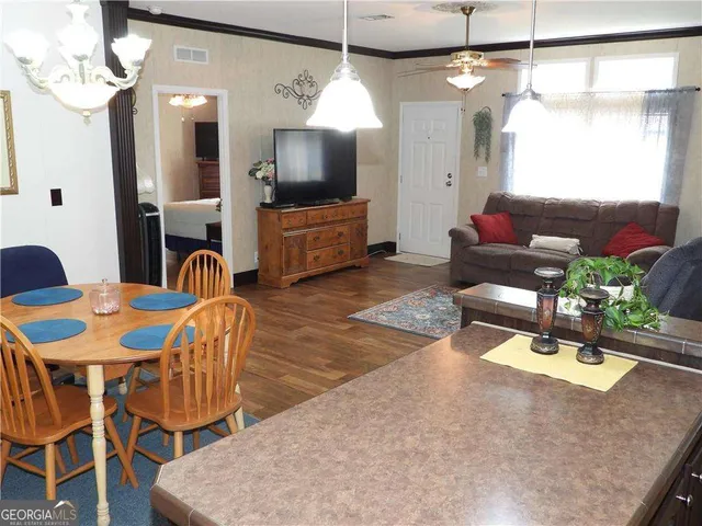 a kitchen with a sink a stove and a window