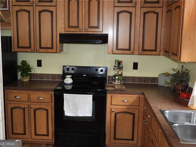 a bedroom with a bed and a flat tv screen